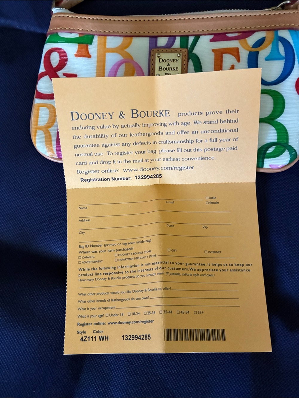 Dooney & Bourke Multicolor Letter Print Wristlet - Cream with Tan Trim - Picture 2 of 4